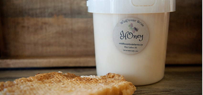 Image of the a bucket of honey from Wildflower Bride FaRMS